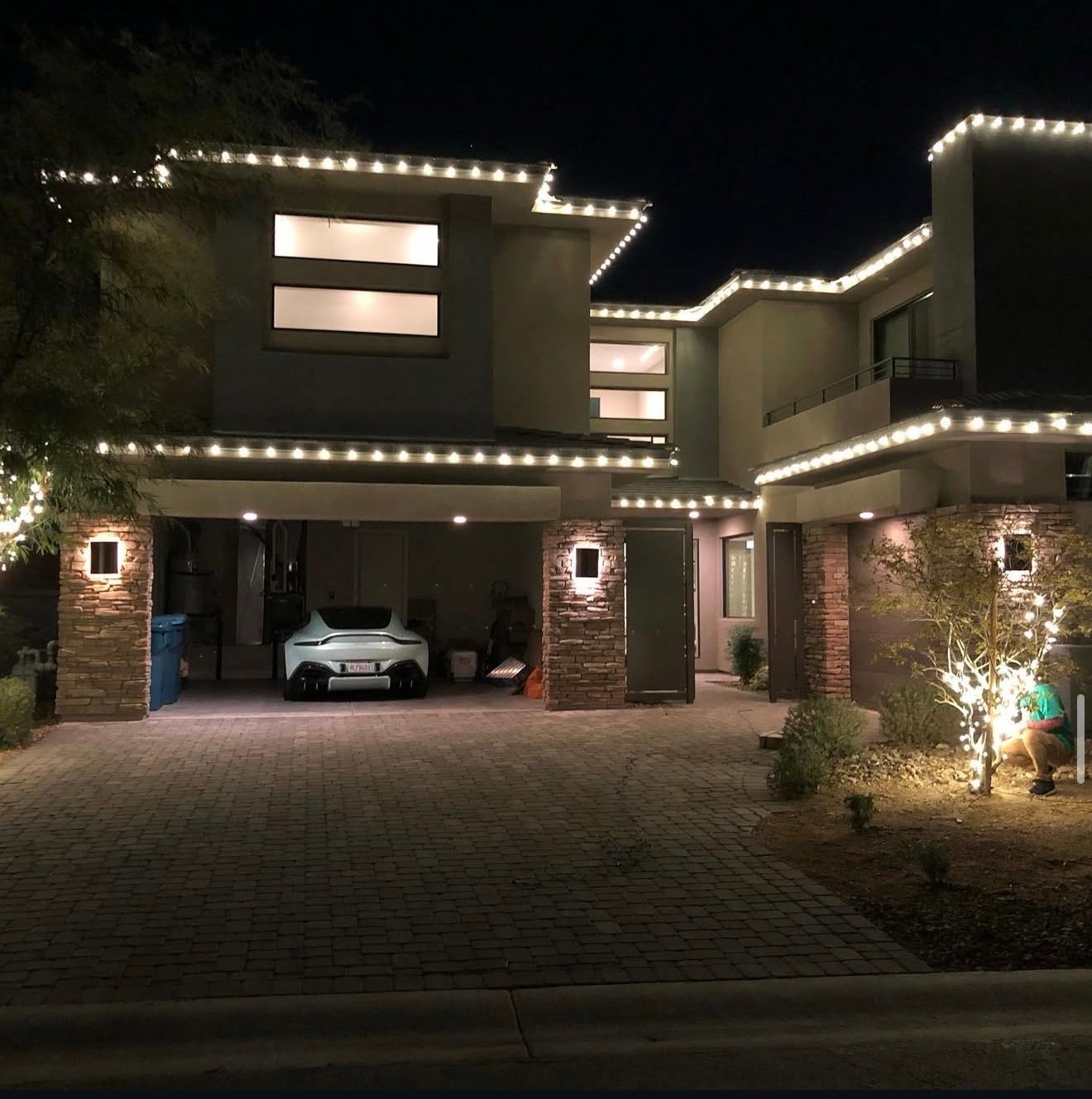 Modern home roofline lighting at night