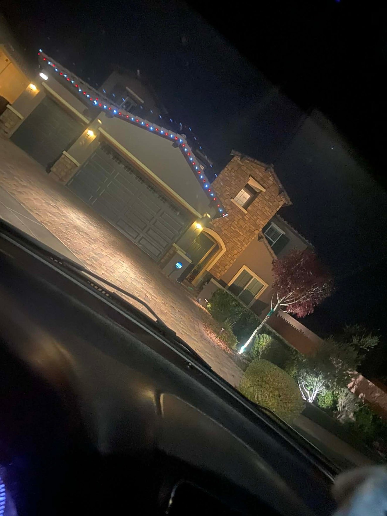 Holiday roofline lighting at night